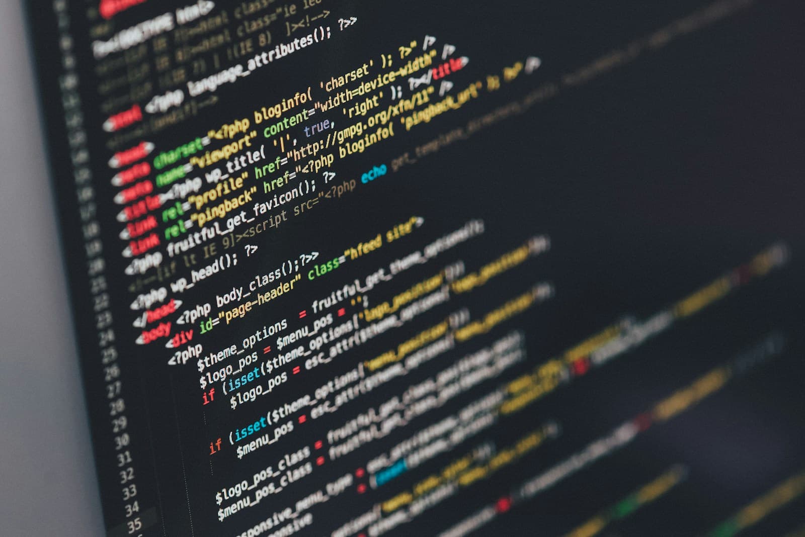 Close-up of programming code displayed on a monitor
